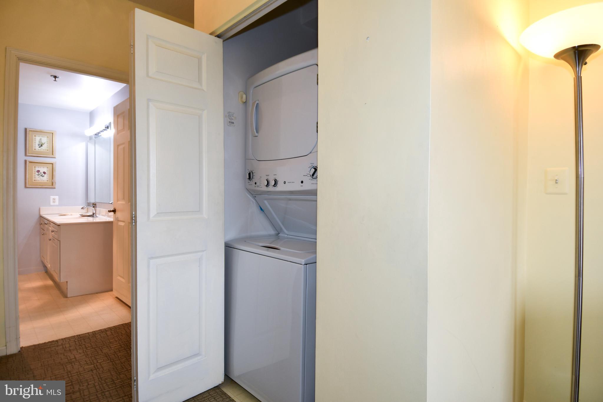 3210 North Leisure World Boulevard, Unit 519 Silver Spring, MD 20906 - Photo 27 of 64 a room with a sink and a mirror