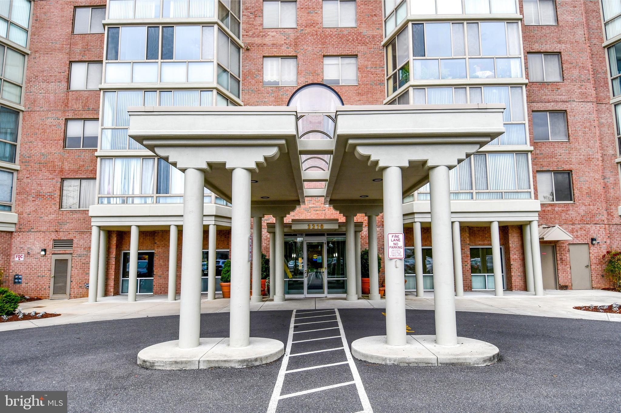 3210 North Leisure World Boulevard, Unit 519 Silver Spring, MD 20906 - Photo 31 of 64 front view of a brick building