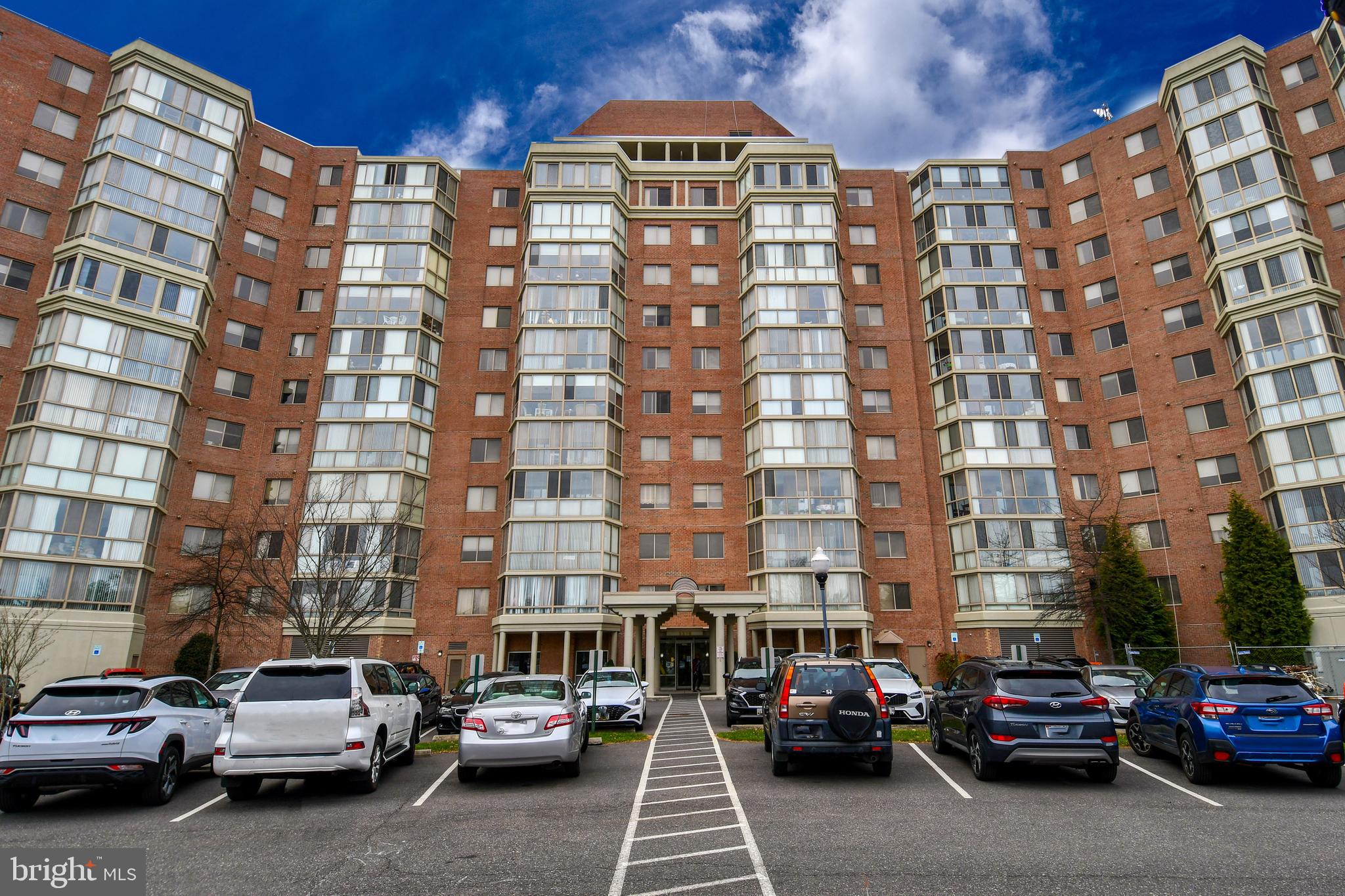 3210 North Leisure World Boulevard, Unit 519 Silver Spring, MD 20906 - Photo 32 of 64 a city street filled with lots of cars and buildings