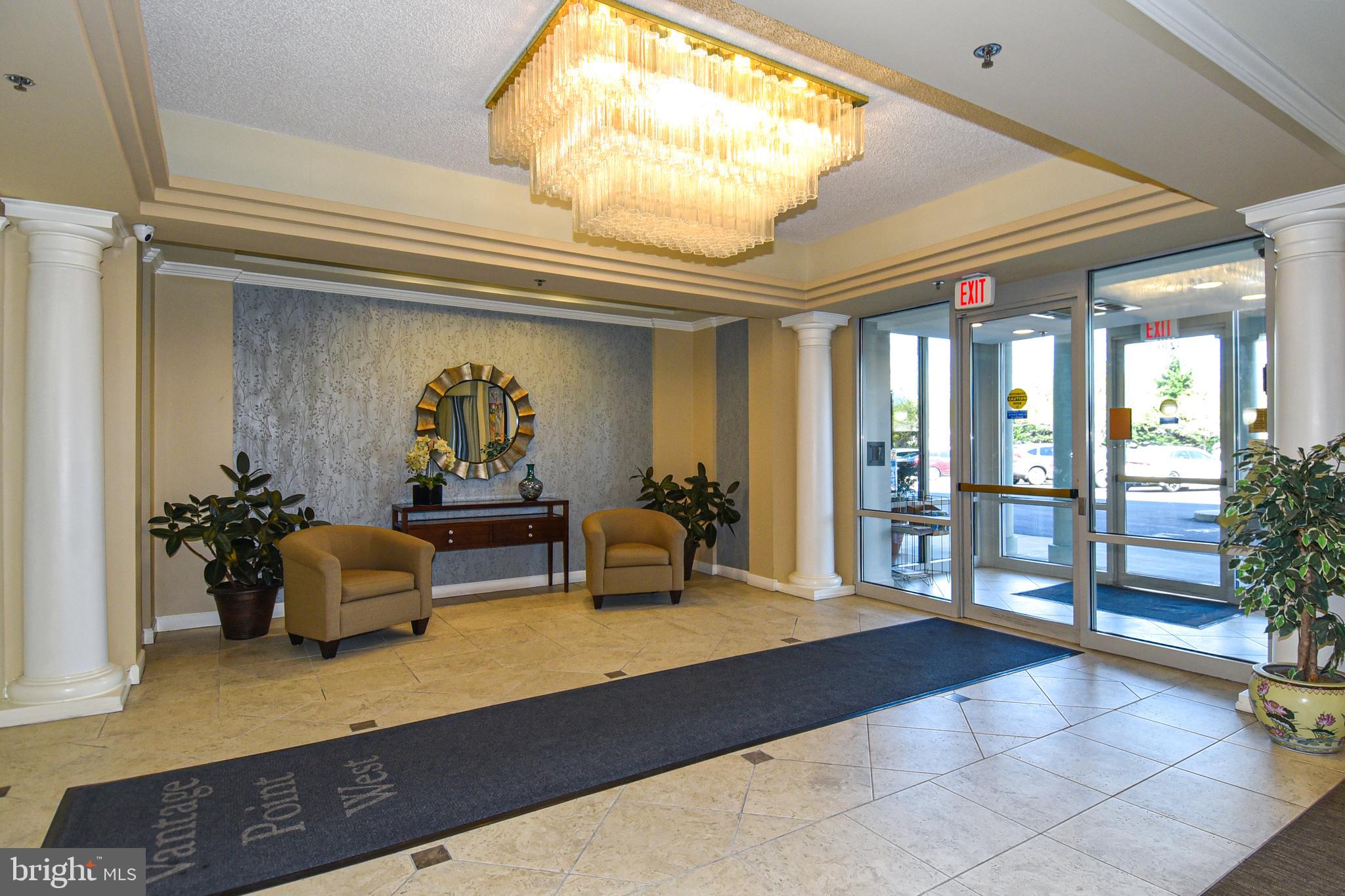 3210 North Leisure World Boulevard, Unit 519 Silver Spring, MD 20906 - Photo 36 of 64 a living room with furniture and potted plants