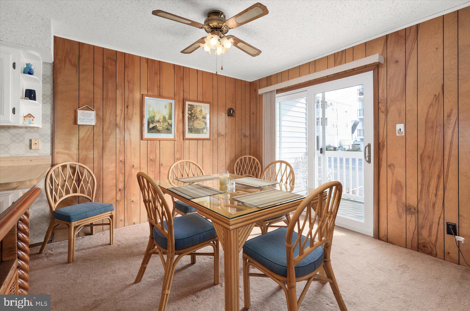 12 128th Street, Unit 2 Ocean City, MD 21842 - Photo 16 of 40 a view of a dining room with furniture window and outside view