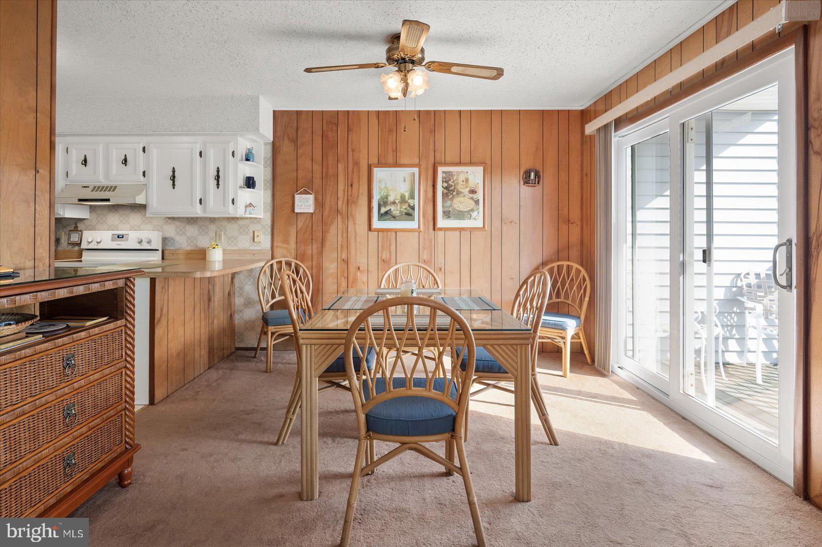 12 128th Street, Unit 2 Ocean City, MD 21842 - Photo 17 of 40 a view of a dining room with furniture window and outside view
