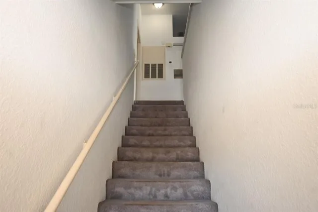 a view of a room with window and ceiling fan