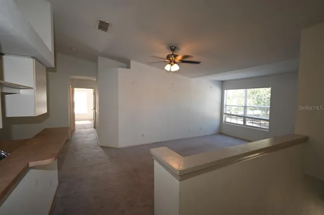 a kitchen with a sink cabinets and window
