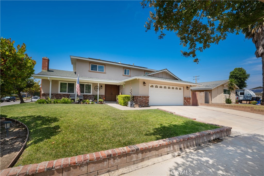 2203 Homewood Avenue Simi Valley, CA 93063 - Photo 1 of 37 a front view of a house with a yard and garage
