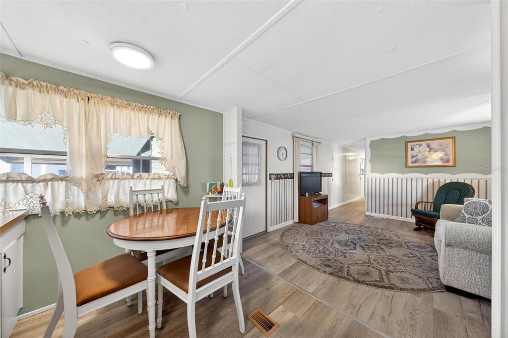 684 Cindi Avenue Leesburg, FL 34788 - Photo 18 of 60 a dining room with furniture and window