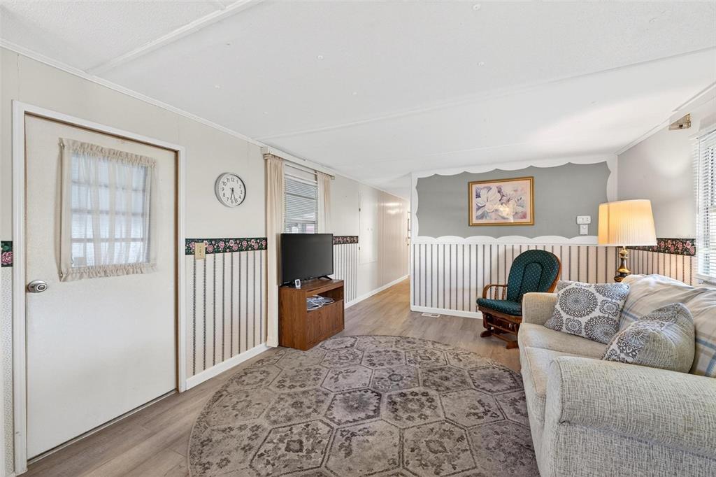 684 Cindi Avenue Leesburg, FL 34788 - Photo 21 of 60 a living room with furniture and a window