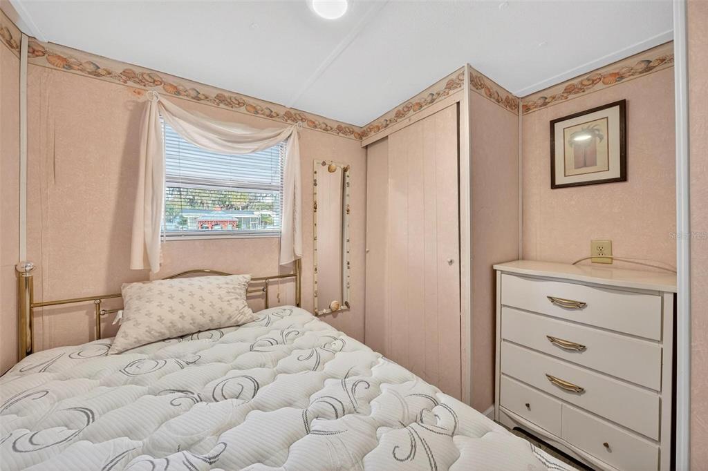 684 Cindi Avenue Leesburg, FL 34788 - Photo 25 of 60 a bedroom with a bed and a window