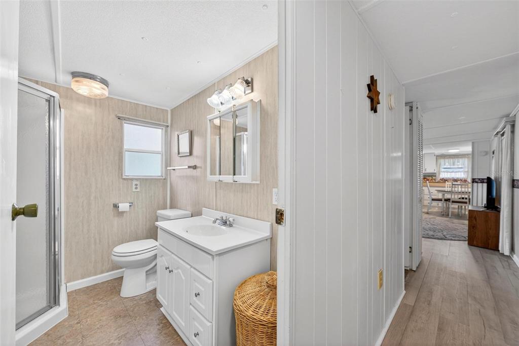 684 Cindi Avenue Leesburg, FL 34788 - Photo 26 of 60 a spacious bathroom with a granite countertop sink toilet and shower