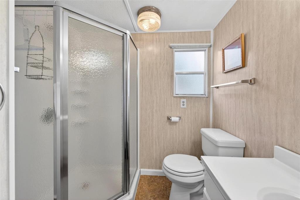 684 Cindi Avenue Leesburg, FL 34788 - Photo 28 of 60 a white toilet sitting next to a bathroom sink