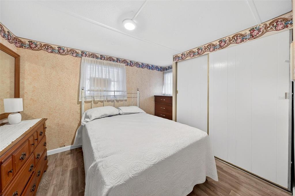 684 Cindi Avenue Leesburg, FL 34788 - Photo 30 of 60 a bedroom with a bed and a window