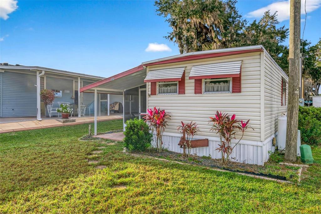 684 Cindi Avenue Leesburg, FL 34788 - Photo 5 of 60 a view of house with a backyard