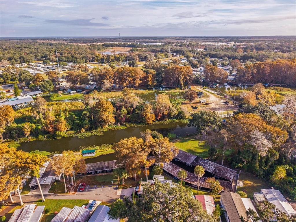 684 Cindi Avenue Leesburg, FL 34788 - Photo 53 of 60 an aerial view of residential building and lake