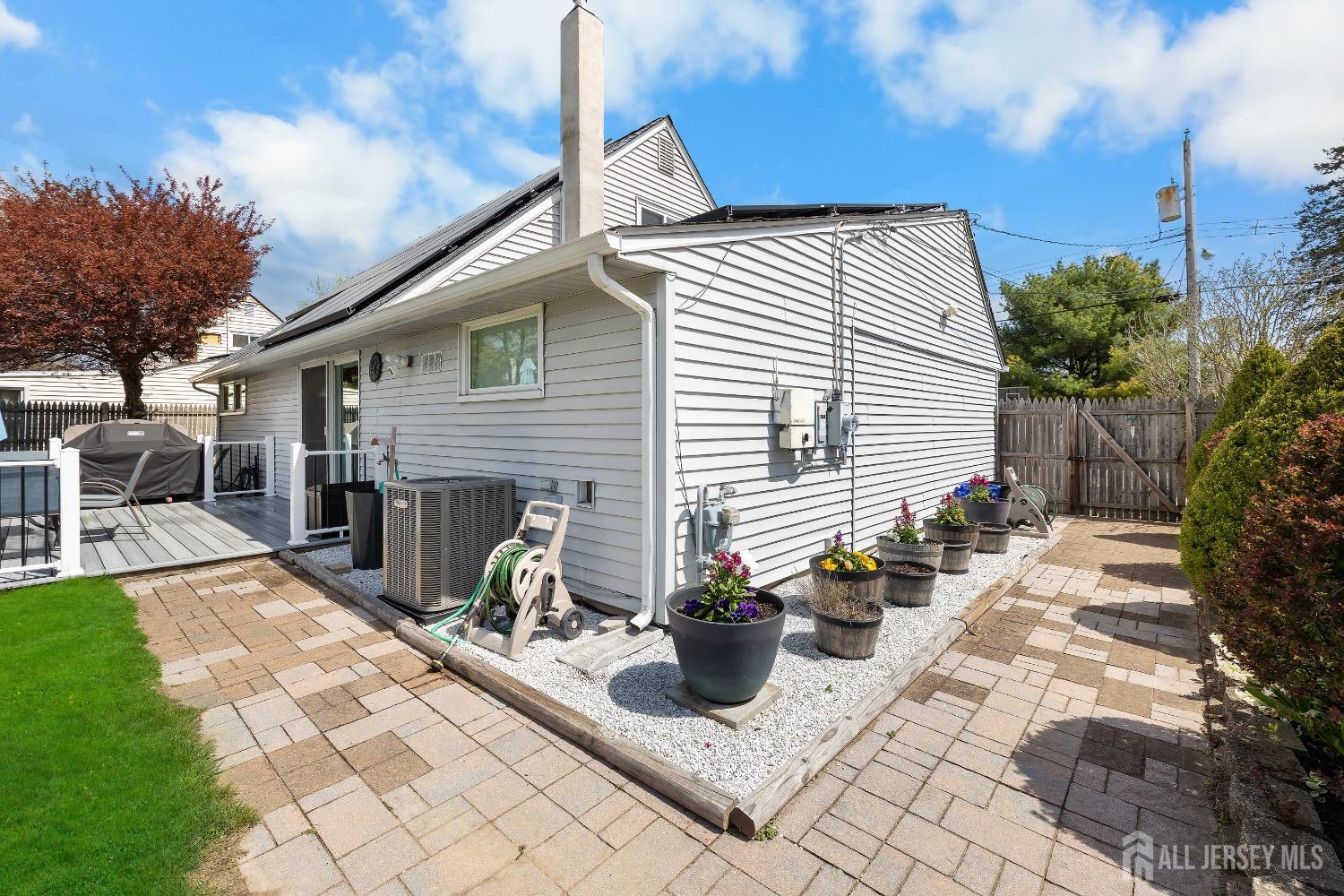 9 Pine Tree Road Old Bridge, NJ 08857 - Photo 11 of 46 a view of a patio with chairs and potted plants