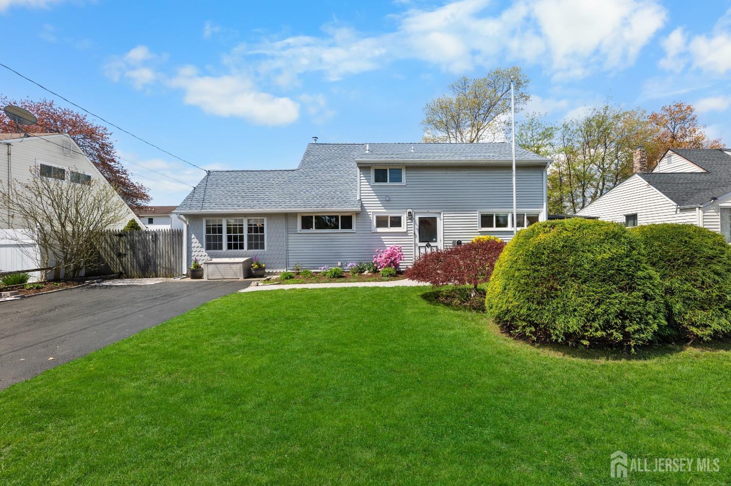 9 Pine Tree Road Old Bridge, NJ 08857 - Photo 13 of 46 a view of an house with backyard and a tree