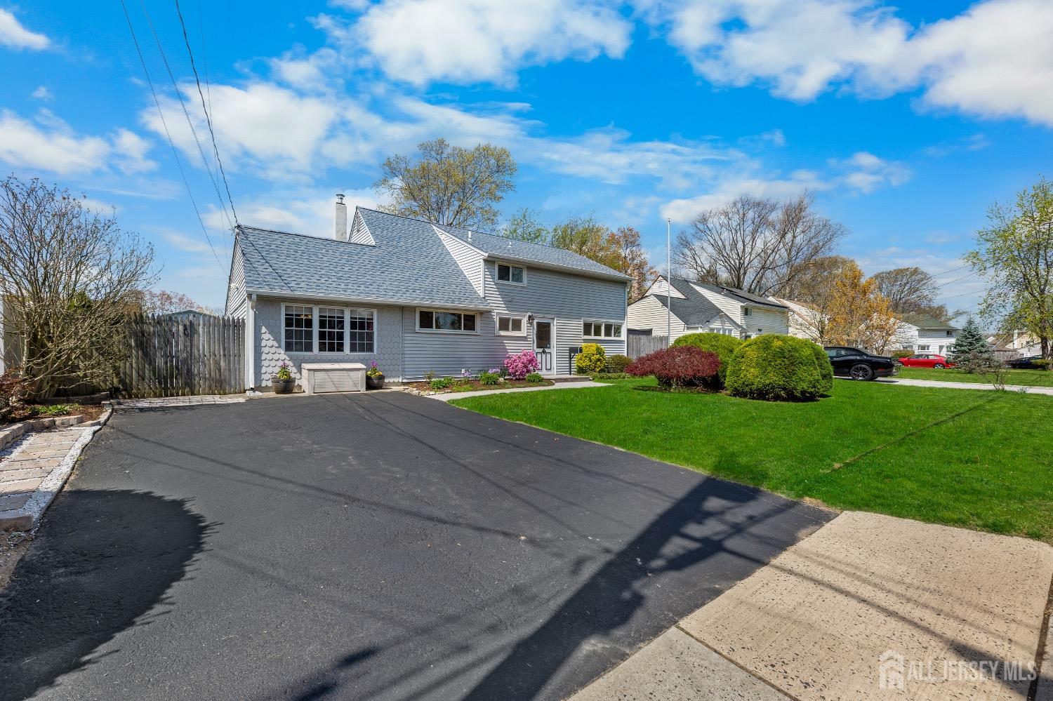 9 Pine Tree Road Old Bridge, NJ 08857 - Photo 14 of 46 a house with green field in front of it