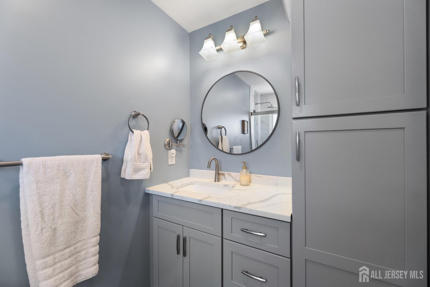 9 Pine Tree Road Old Bridge, NJ 08857 - Photo 16 of 46 a bathroom with a sink and a mirror