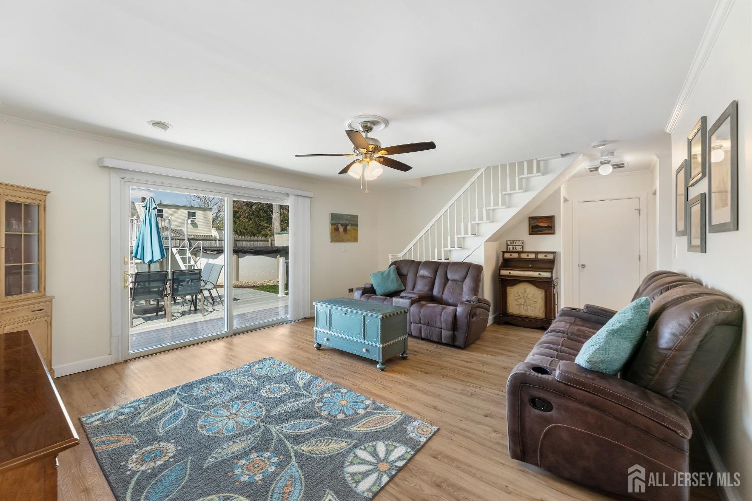 9 Pine Tree Road Old Bridge, NJ 08857 - Photo 20 of 46 a living room with furniture ceiling fan and a rug