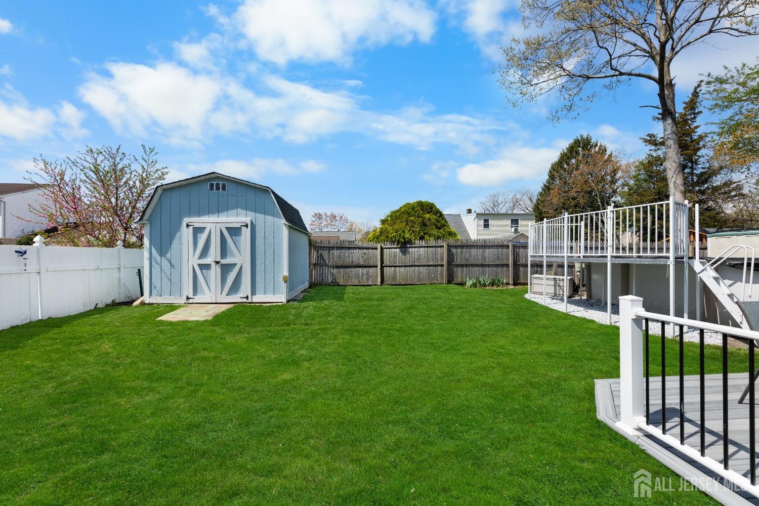 9 Pine Tree Road Old Bridge, NJ 08857 - Photo 2 of 46 a view of a garden with a small yard