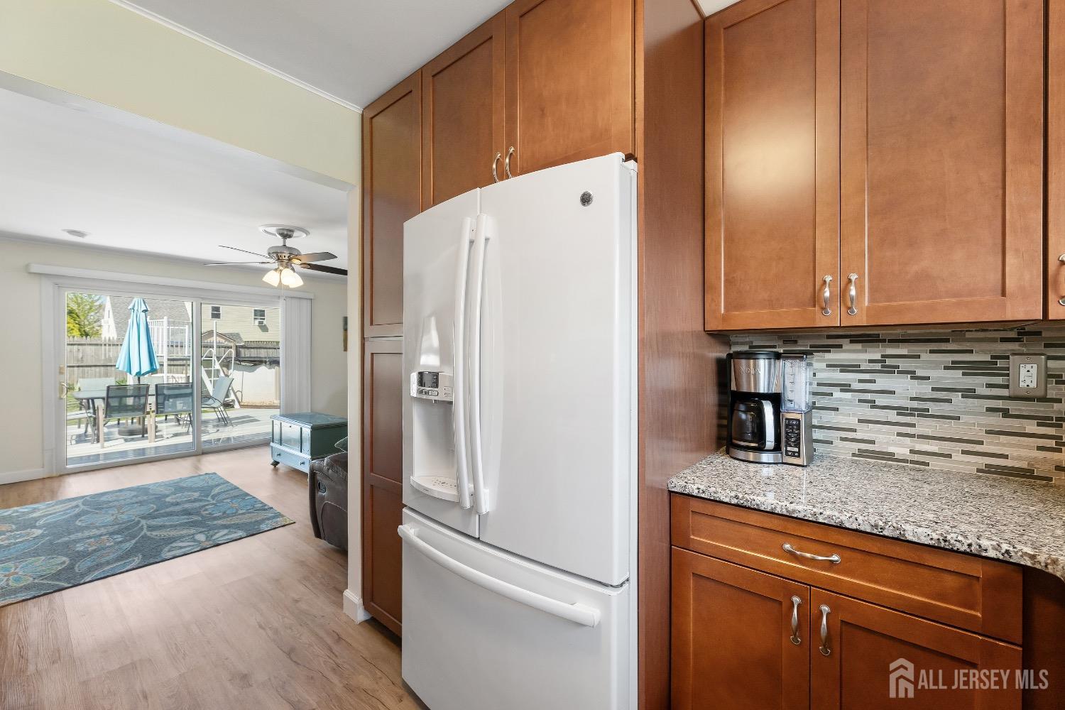 9 Pine Tree Road Old Bridge, NJ 08857 - Photo 24 of 46 a kitchen with granite countertop a refrigerator and a sink