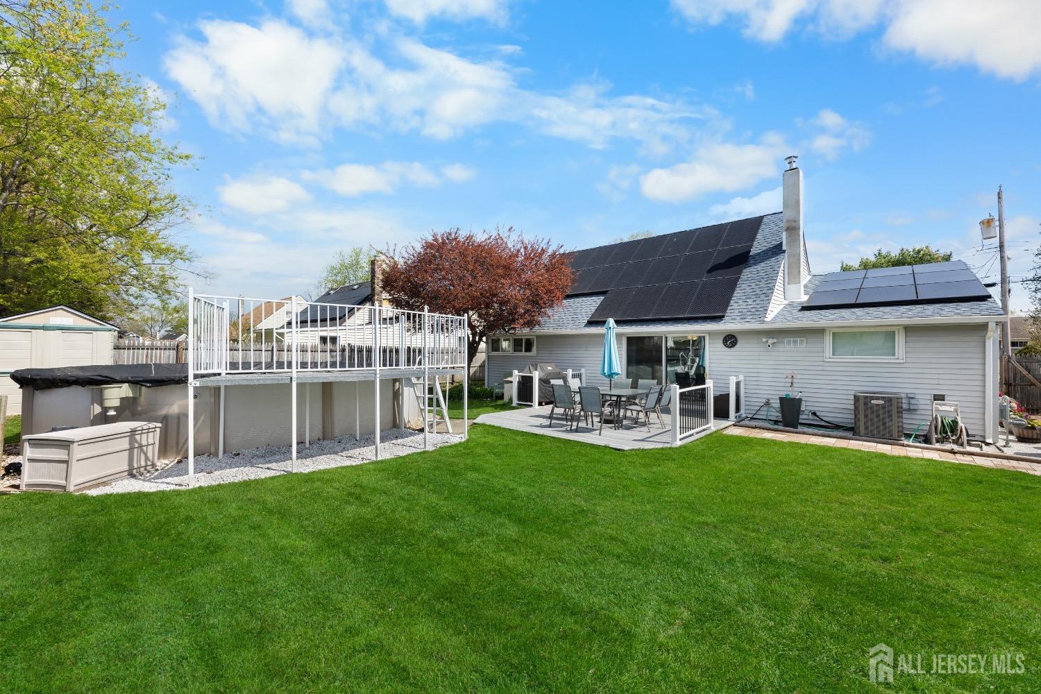 9 Pine Tree Road Old Bridge, NJ 08857 - Photo 3 of 46 a view of a house with a yard fire pit and a patio
