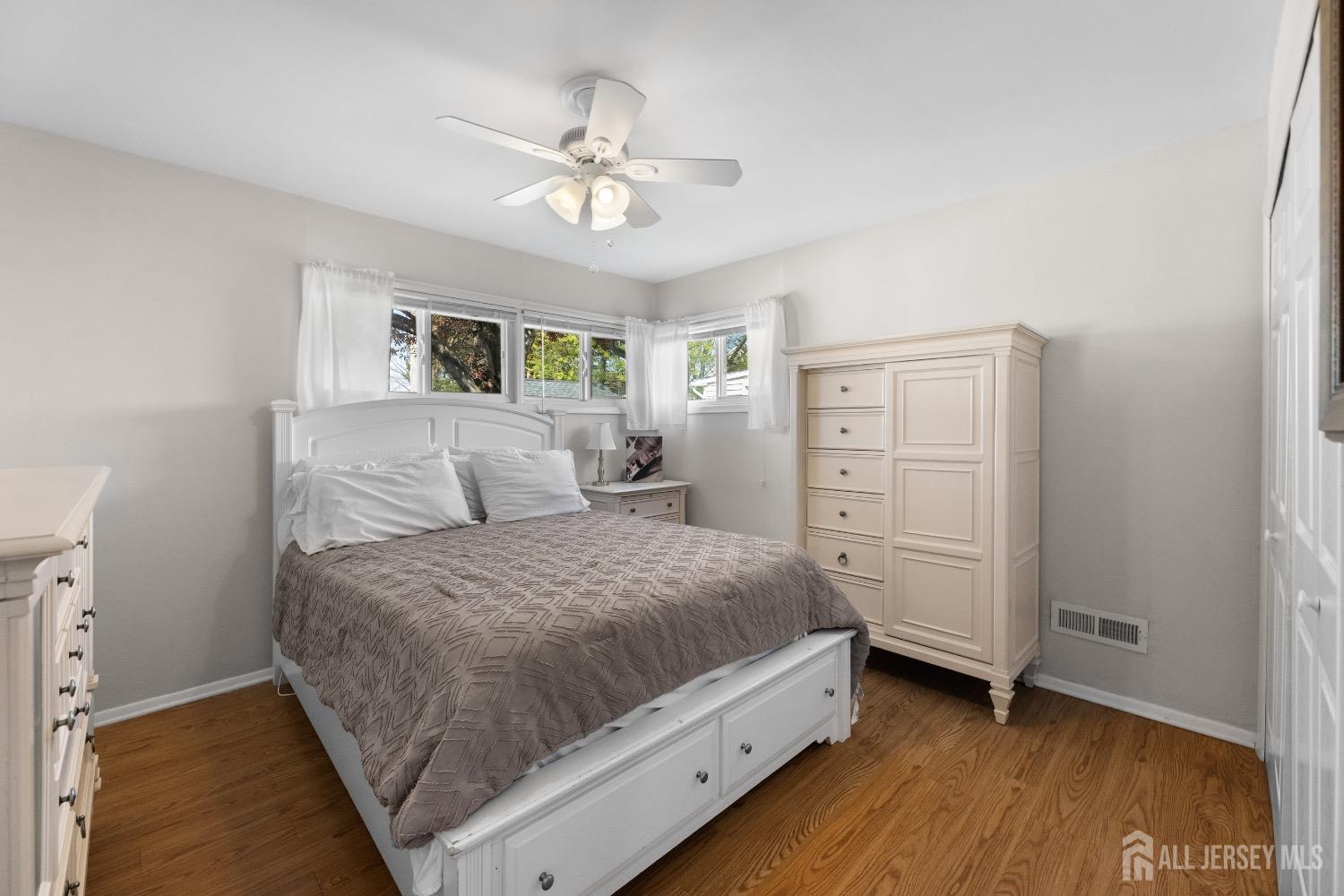 9 Pine Tree Road Old Bridge, NJ 08857 - Photo 32 of 46 a room with a bed and a chandelier