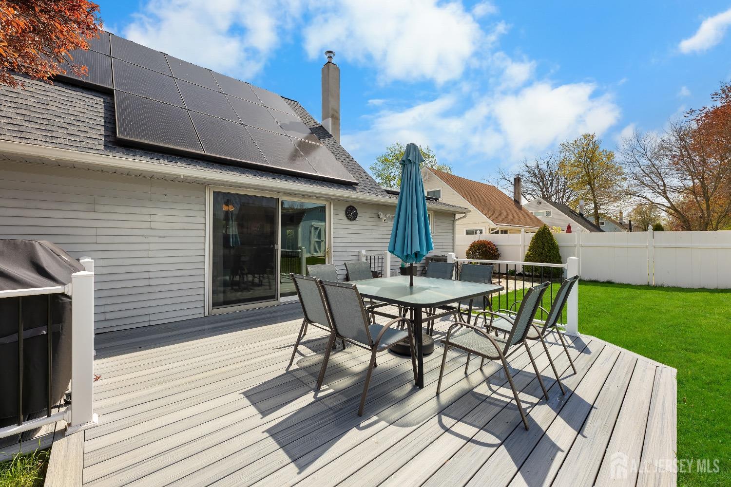 9 Pine Tree Road Old Bridge, NJ 08857 - Photo 7 of 46 a view of a patio with table and chairs with wooden floor and fence