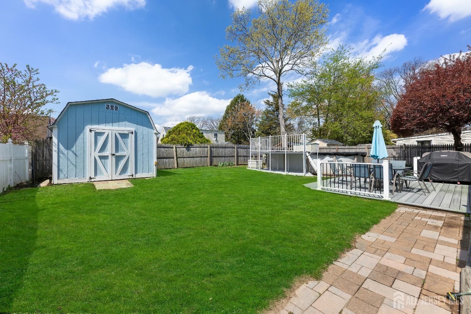 9 Pine Tree Road Old Bridge, NJ 08857 - Photo 8 of 46 a view of a porch with a garden