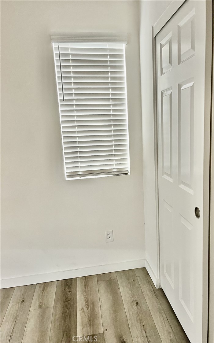 4255 Vermillion Court Riverside, CA 92505 - Photo 13 of 20 a view of a room with wooden floor and a window
