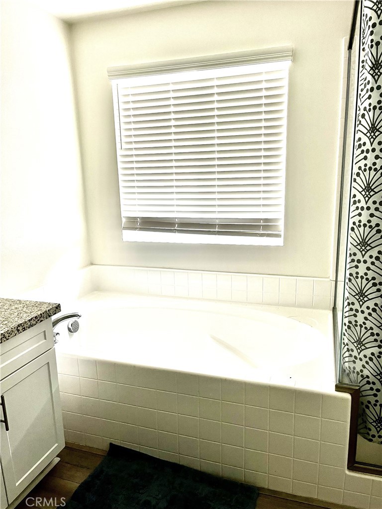 4255 Vermillion Court Riverside, CA 92505 - Photo 16 of 20 a bathroom with a sink and a bathtub