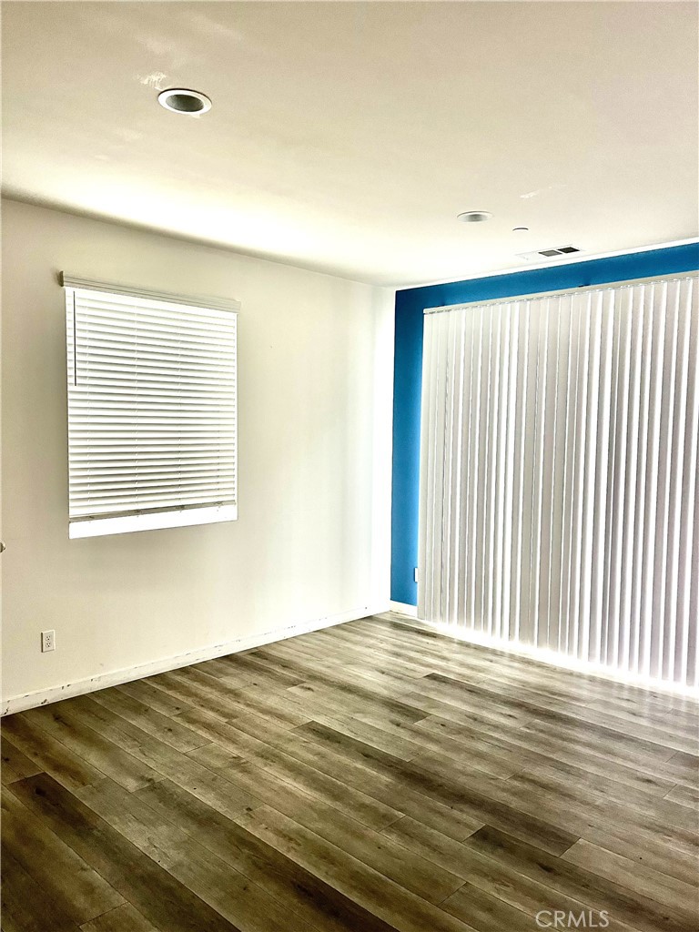 4255 Vermillion Court Riverside, CA 92505 - Photo 4 of 20 a view of a room with a wooden floor