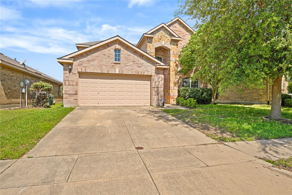 2003 Diamondback Forney, TX 75126 - Photo 2 of 30 View of front of home featuring a front yard and a garage