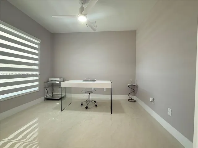 a room with a window and gym equipment