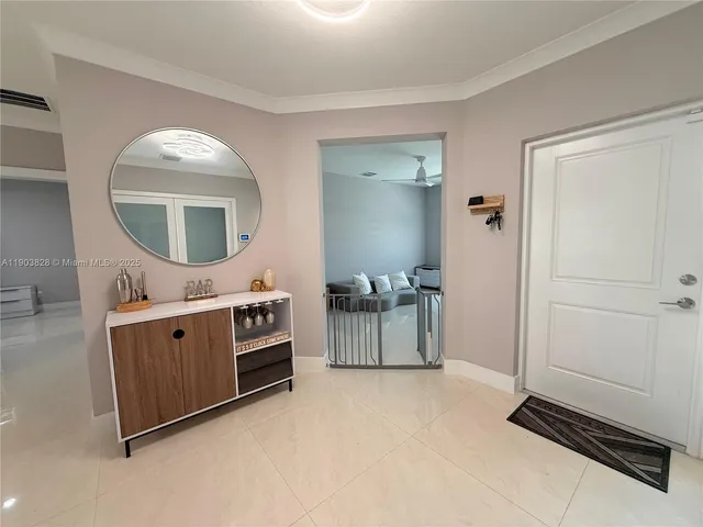 a spacious bathroom with a mirror and a sink