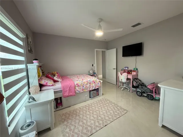 a bedroom with furniture and a bed