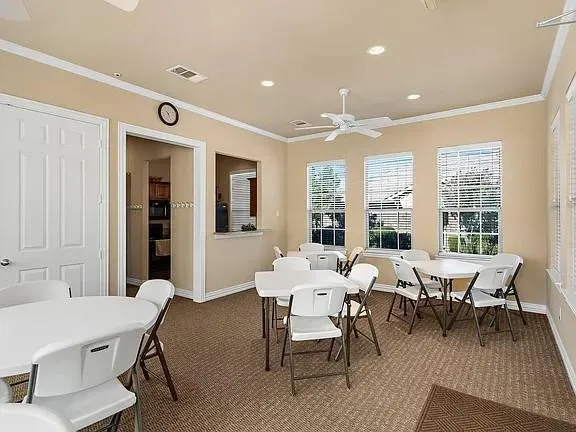a view of a dining room with furniture and window