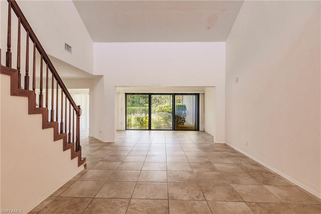 2118 Buckingham Lane Naples, FL 34112 - Photo 12 of 41 a view of an entryway with staircase