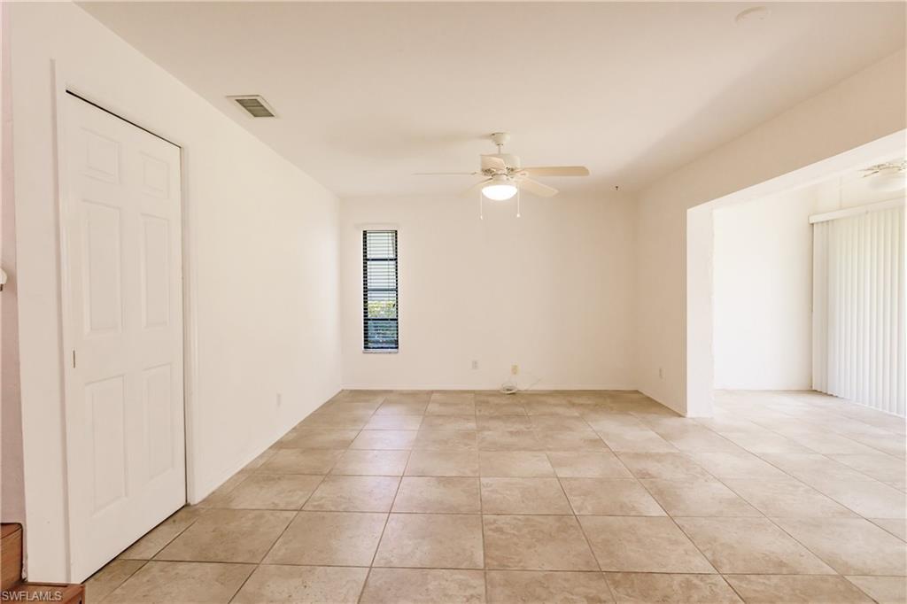 2118 Buckingham Lane Naples, FL 34112 - Photo 15 of 41 an empty room with a ceiling fan and a window