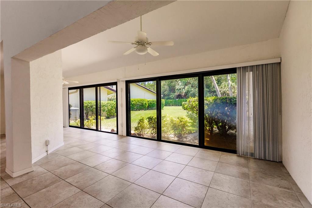 2118 Buckingham Lane Naples, FL 34112 - Photo 18 of 41 a view of an entryway with a floor to ceiling window and an entryway