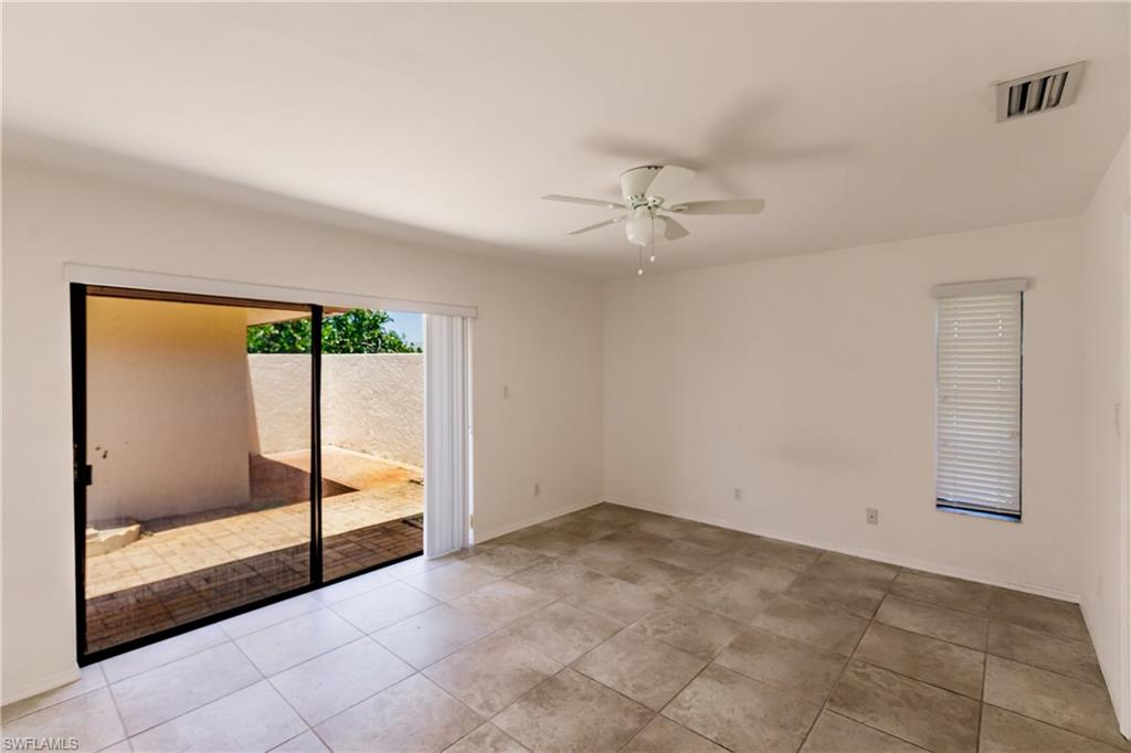 2118 Buckingham Lane Naples, FL 34112 - Photo 22 of 41 a view of an empty room with a window