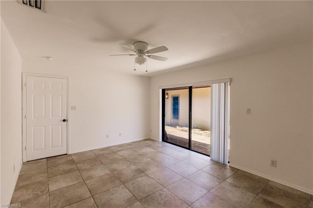 2118 Buckingham Lane Naples, FL 34112 - Photo 23 of 41 a view of an empty room with a window