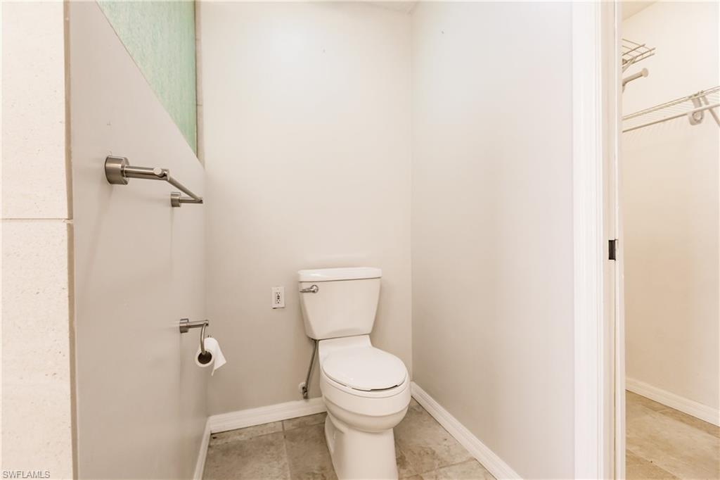 2118 Buckingham Lane Naples, FL 34112 - Photo 27 of 41 a white toilet sitting next to a white sink