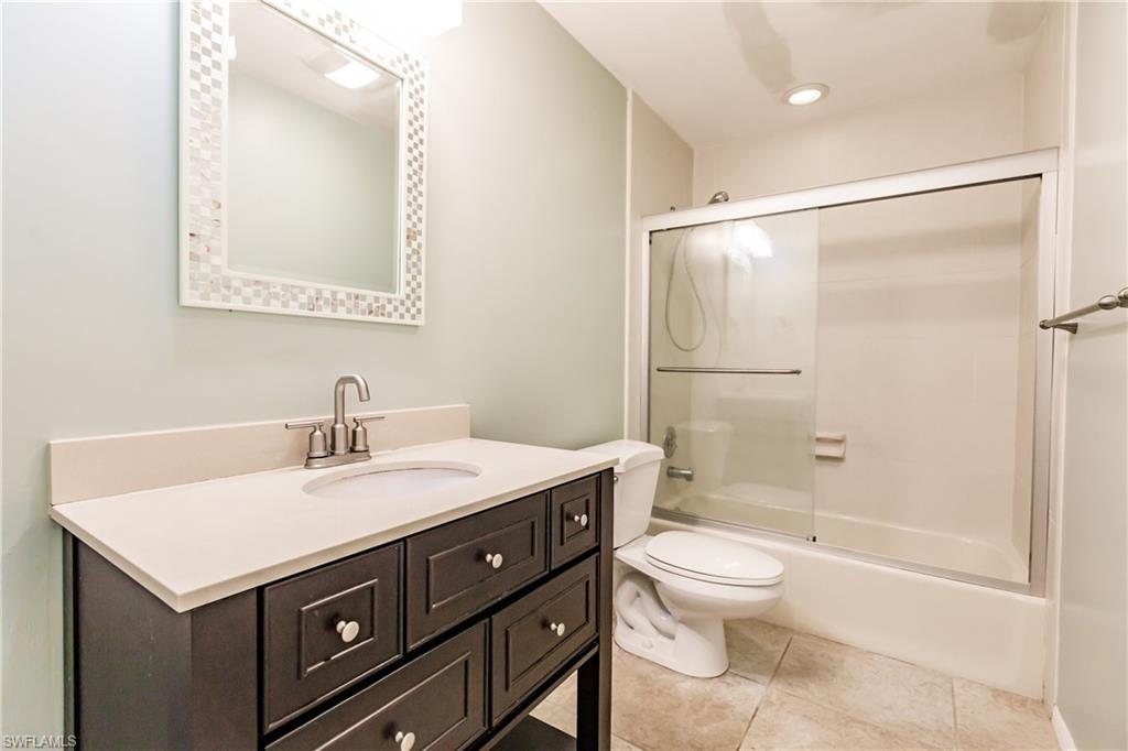 2118 Buckingham Lane Naples, FL 34112 - Photo 32 of 41 a bathroom with a sink a toilet and shower