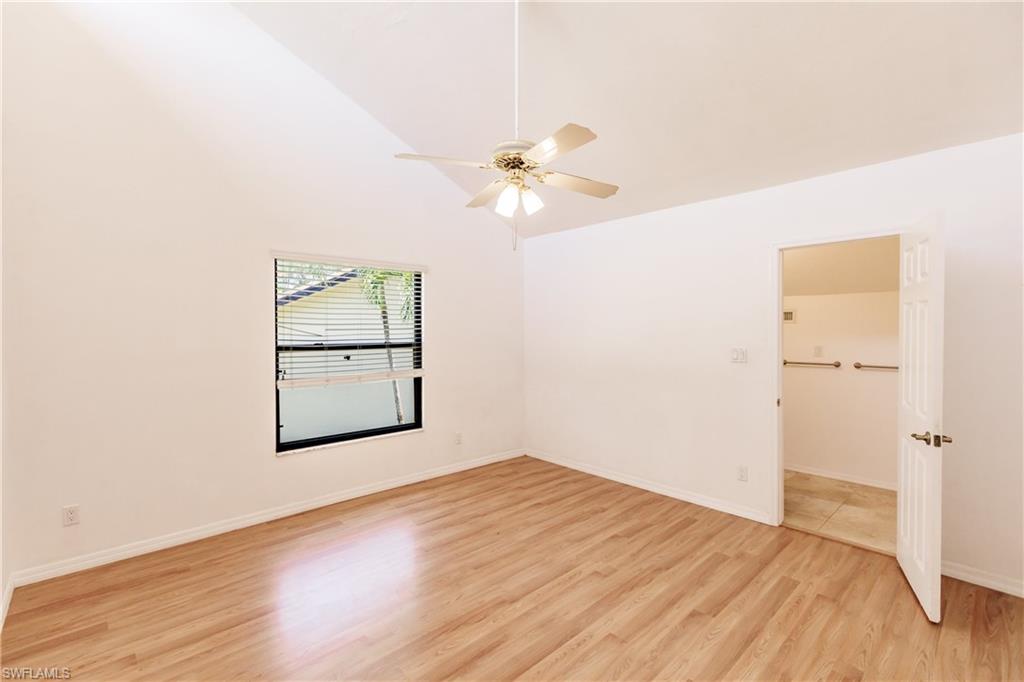 2118 Buckingham Lane Naples, FL 34112 - Photo 35 of 41 wooden floor in an empty room with a window