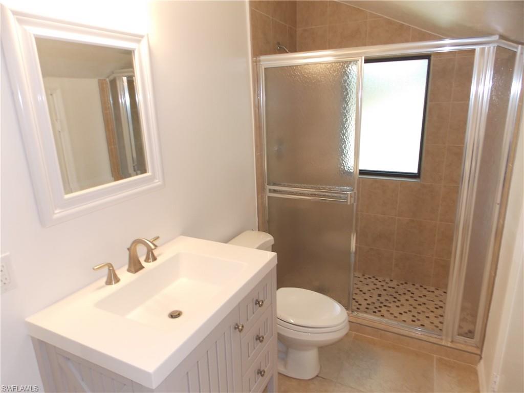 2118 Buckingham Lane Naples, FL 34112 - Photo 37 of 41 a bathroom with a sink toilet and shower