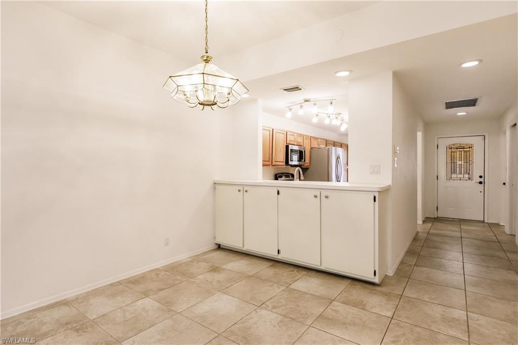 2118 Buckingham Lane Naples, FL 34112 - Photo 10 of 41 a view of a kitchen with electric appliances