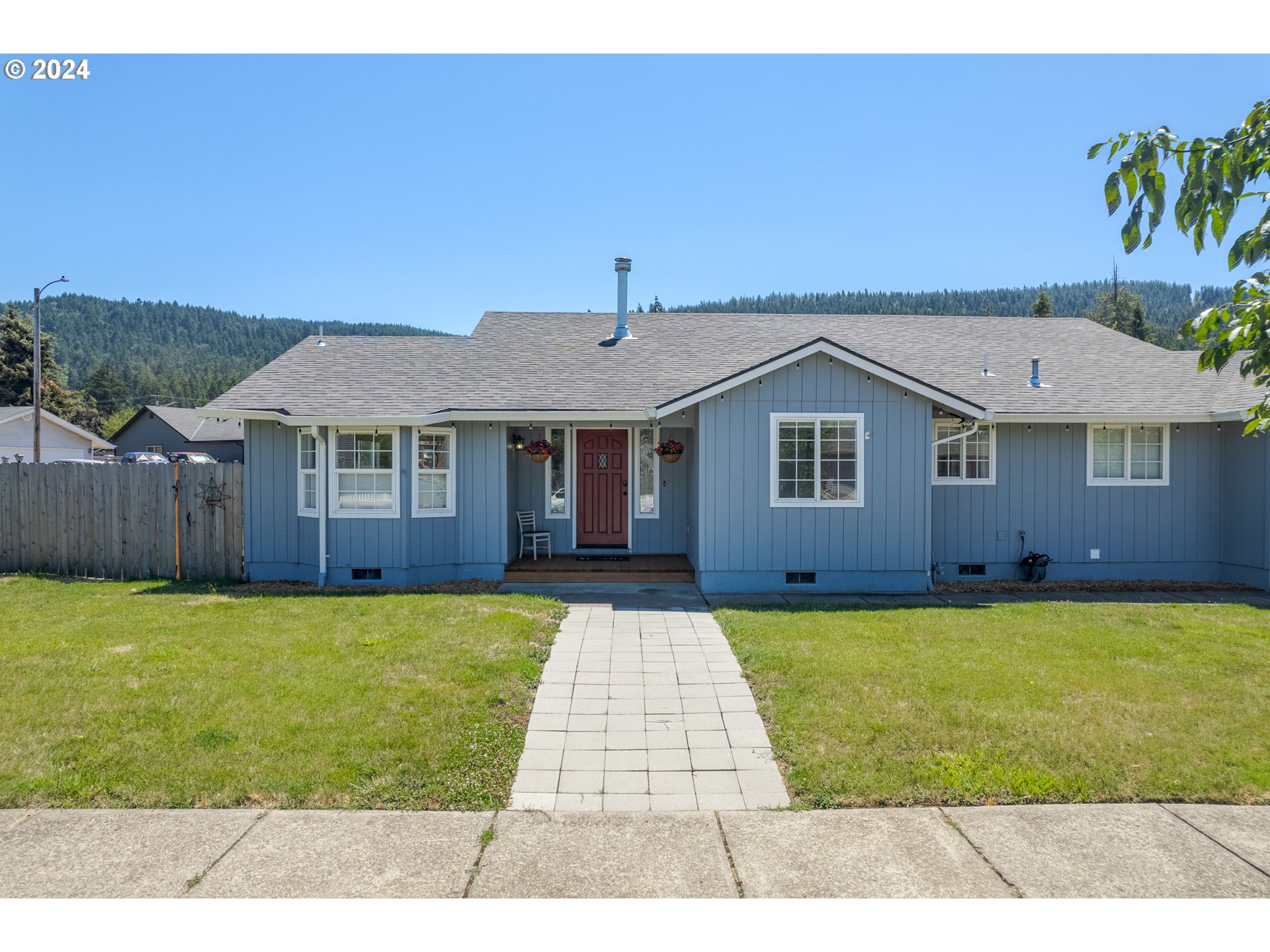 7345 B Street Springfield, OR 97478 - Photo 1 of 48 a front view of a house with garden