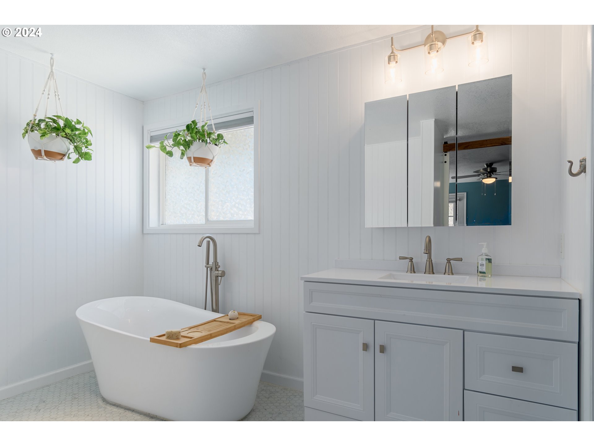 7345 B Street Springfield, OR 97478 - Photo 20 of 48 a bathroom with a sink and a mirror