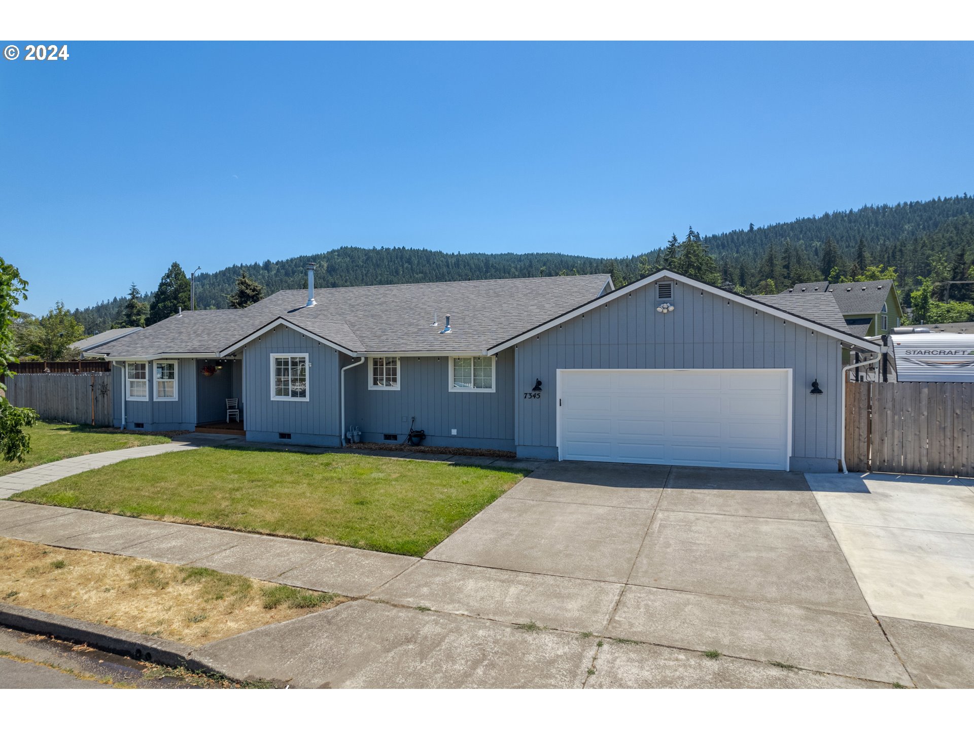 7345 B Street Springfield, OR 97478 - Photo 2 of 48 a front view of a house with a yard