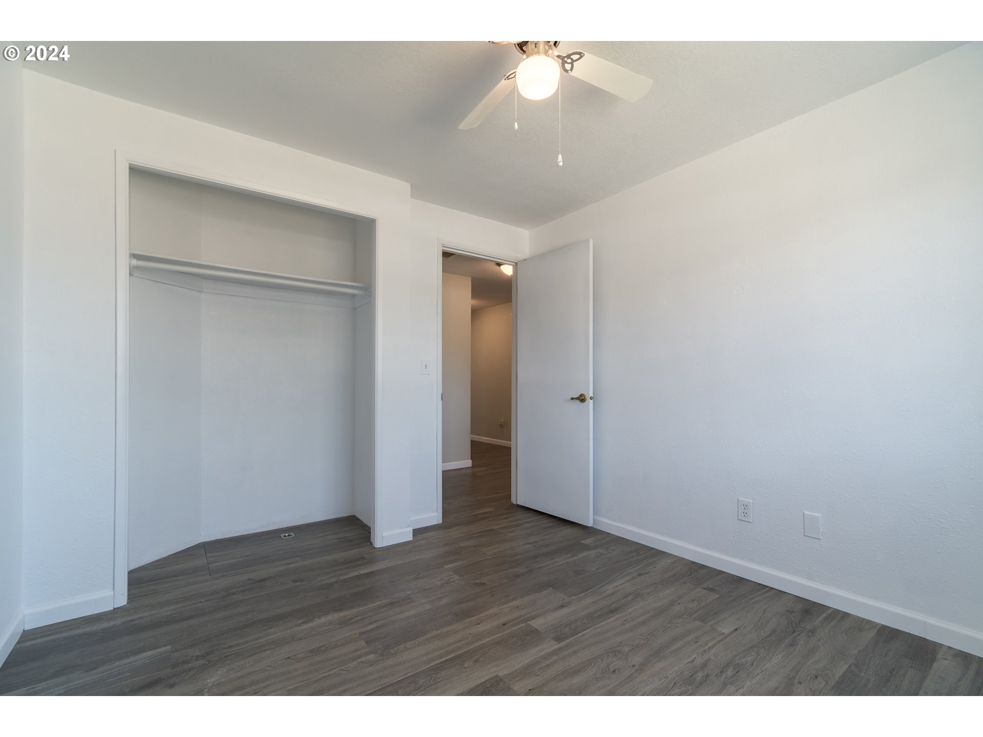 7345 B Street Springfield, OR 97478 - Photo 27 of 48 a view of an empty room with wooden floor